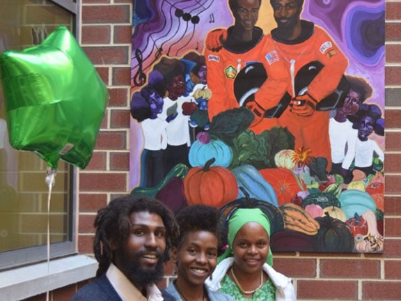 Misty Sol creates a mural for the Musical Garden Program at Bluford Elementary