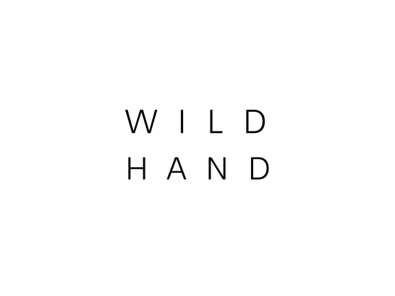 Black text on white back ground says Wild Hand in all caps